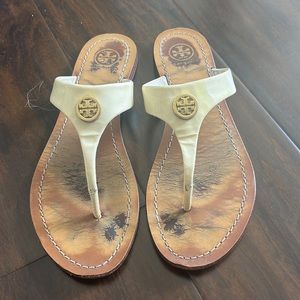 Tory Burch white sandal with gold emblem. Used condition.